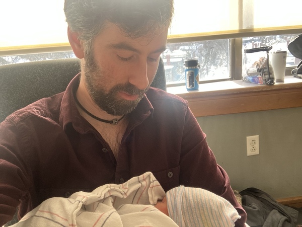 Picture of Matt holding a baby